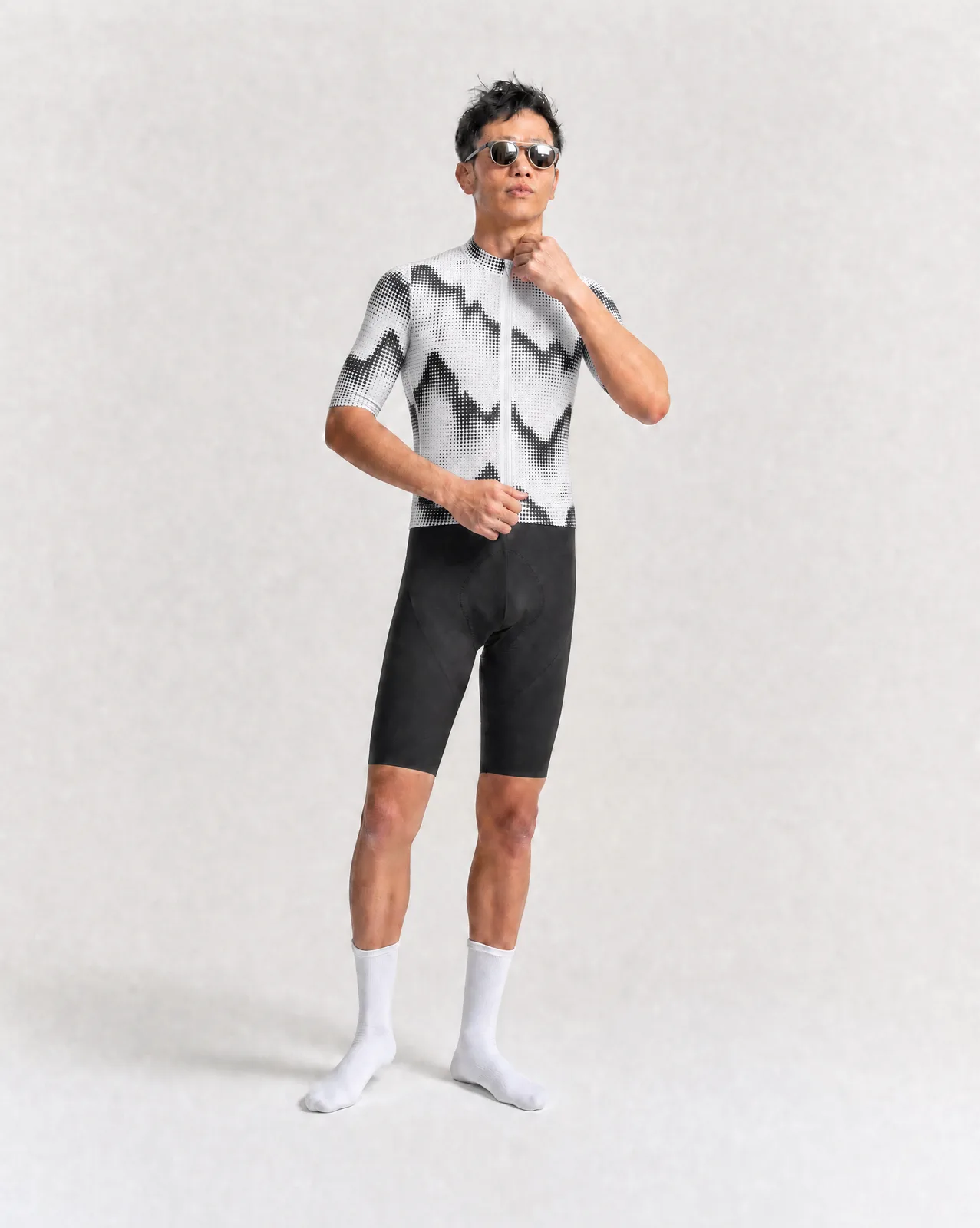 Jersey Geometric Pattern, full body view, rider wearing black bib shorts, white socks